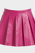 Macro shot of smooth fuchsia leather grain and structured knife pleat detailing on skirt. The Poppy by Maverick Jacket.