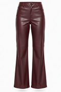 Women's burgundy leather flare pants with horizontal knee seams and classic five-pocket styling, Front View. The Bianca by Maverick Jacket.