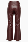 Rear view of burgundy leather flare pants showing rear patch pockets and structured knee paneling. The Bianca by Maverick Jacket.