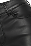 Macro shot of black leather grain and pocket stitching detail on flare pants. The Bianca by Maverick Jacket.