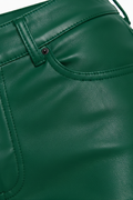 Macro shot of green leather grain and pocket stitching detail on flare pants. The Bianca by Maverick Jacket.