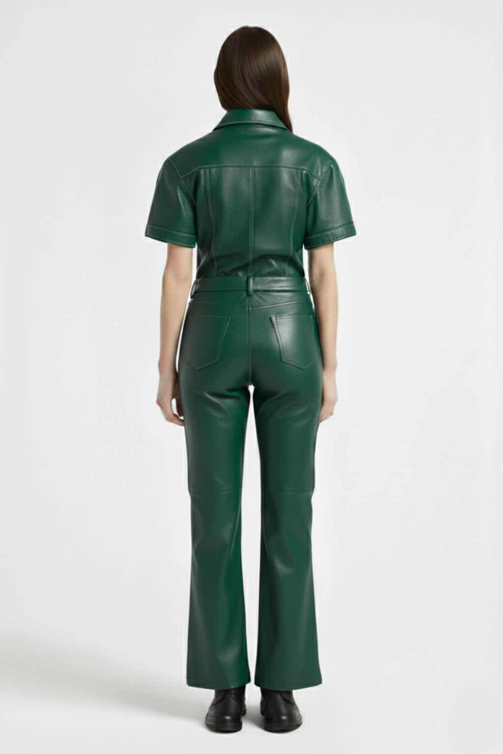 Rear view of female model wearing Maverick Bianca leather flare pants showing fitted seat and bootcut leg styling. Maverick Jacket.