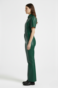 Side profile of Maverick Bianca leather flare pants showing clean side seams and flared silhouette. Maverick Jacket.