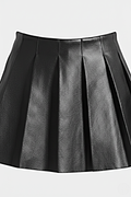Macro shot of smooth black leather grain and structured knife pleat detailing on skirt. The Poppy by Maverick Jacket.