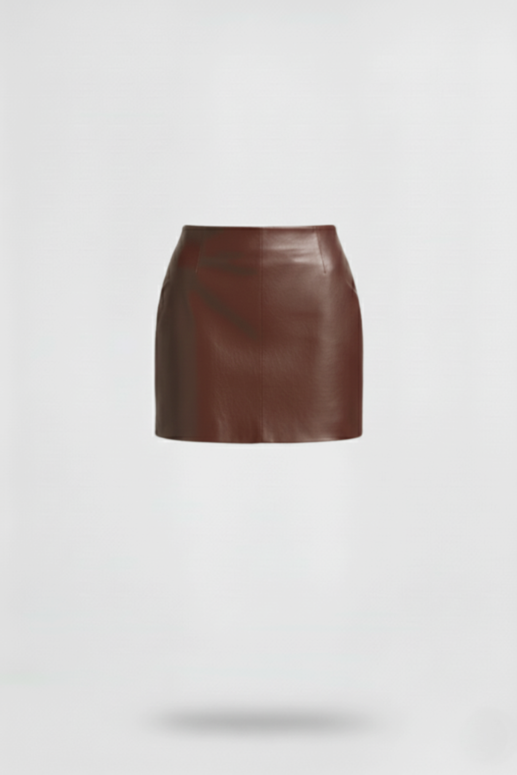 Women's brown leather mini skirt with high waist fit and vertical paneling seams, Front View. The Orla by Maverick Jacket.