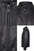 Close-up of the Maverick Lennox black leather cafe racer jacket, showing its gunmetal front zipper and pebble grain.
