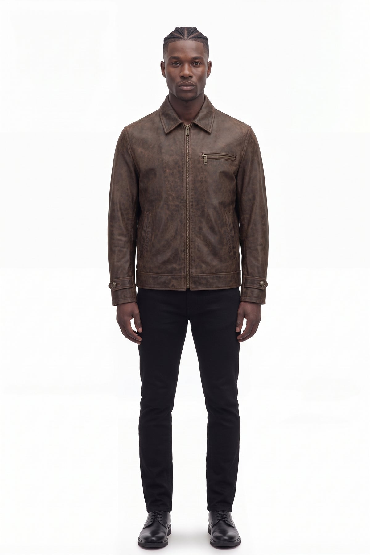 Front view of male model in Maverick Conroy brown leather sport jacket, black crewneck and denim; hem meets waist.