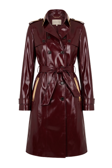 A glossy burgundy leather trench coat with beige shoulder and pocket accents, shown on a plain white background.