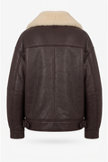 Detail of the Maverick Taryn B-3 shearling bomber jacket, highlighting distressed brown leather and cream shearling trim.