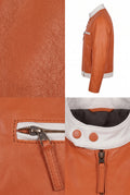 A multi-panel product detail shot of a Maverick Kestrel cafe racer jacket in a warm cognac orange. The collage includes a full side profile view, a close-up of the textured leather, a detail of the zippered chest pocket with a leather pull tab, and a close-up of the collar showing a white contrast panel and dark gray interior lining.
