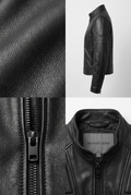 Close-up of the Maverick Nyra black leather track moto jacket, showing dark metal zipper teeth and textured leather.
